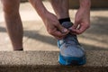 Male athlete Runner tying running shoes