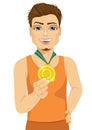 Male athlete showing his gold medal