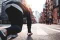 Young sporty man prepearing to start on urban running through on New York streets Royalty Free Stock Photo