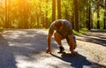 Male athlete on starting blocks looking down Royalty Free Stock Photo