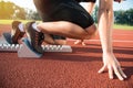 Male athlete on starting position at athletics running track. Royalty Free Stock Photo