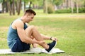 Male athlete suffering from foot pain during training Royalty Free Stock Photo