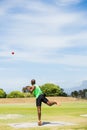 Male athlete throwing shot put ball