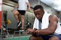 Male athletic checking time on watch in fitness center Royalty Free Stock Photo