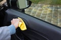 Auto service staff cleaning car door Royalty Free Stock Photo