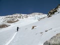 Male back country skier on a ski tour putting first tracks on his way to a high alpine summit in the Monte Rosa mountains in very