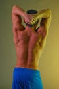 Male back muscles yellow stretching Royalty Free Stock Photo