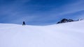 Male backcountry skier climbing a mountain on a beautiful winter day in the Alps near St. Moritz Royalty Free Stock Photo