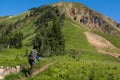 Backpacker on trail below summit Royalty Free Stock Photo