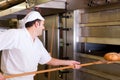 Male baker baking bread