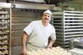 Male baker baking bread rolls Royalty Free Stock Photo
