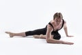 Male Ballerino Dancer While Practising Stretching Exercices In Black Sportive Tights in Studio