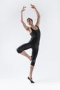 Sportive Caucasian Male Ballet Dancer Flexible Athletic Man Posing in Black Tights in Ballanced Dance Pose