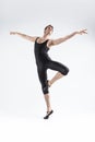 Male Ballet Dancer Flexible Athletic Man Posing in Black Tights in Ballanced Dance Pose With Hands Lifted