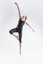 Male Ballet Dancer Young Caucasian Athletic Man in Black Suit Posing Flying Dancing in Studio On White With Lifted Hands Royalty Free Stock Photo