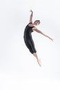 Male Ballet Dancer Young Man in Black Dance Suit Posing in Flying Ballanced Dance Pose Studio