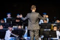 Male band conductor conducting his concert band