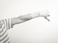 Male bandaged hand with thumb down sign. Royalty Free Stock Photo