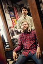 Male barber checking symmetry beard Royalty Free Stock Photo