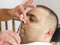 Male barber cutting hairs in the nose by scissors at the adult man in Turkey Royalty Free Stock Photo