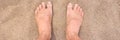 Male Bare Feet On Hot Beach Sand Closeup