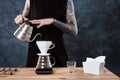 Male barista brewing coffee. Alternative method pour over. Royalty Free Stock Photo