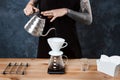 Male barista brewing coffee. Alternative method pour over. Royalty Free Stock Photo