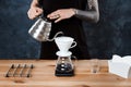 Male barista brewing coffee. Alternative method pour over. Royalty Free Stock Photo