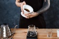 Male barista brewing coffee. Alternative method pour over. Royalty Free Stock Photo