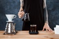 Male barista brewing coffee. Alternative method pour over. Royalty Free Stock Photo