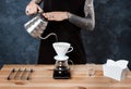 Male barista brewing coffee. Alternative method pour over. Royalty Free Stock Photo