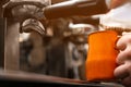 Male barista making espresso using professional coffee machine Royalty Free Stock Photo