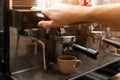 Male barista making espresso using professional coffee Royalty Free Stock Photo