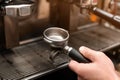 Male barista making espresso using professional coffee machine Royalty Free Stock Photo