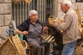 A male basket weaver at a craft market in a hilltop town in Italy