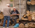 Man looking bored at a market stall at a craft market in Italy