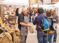 A male basket weaver at a craft market in a hilltop town in Italy