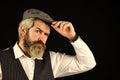 Male beauty standards. Portrait of mature man in victorian gangster outfit. bearded man hipster isolated on black. male Royalty Free Stock Photo