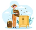 Male beekeeper at the apiary holding barrel with honey