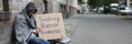 Beggar Showing Seeking Human Kindness Sign On Cardboard Royalty Free Stock Photo