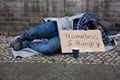 Male Beggar Lying On Street Royalty Free Stock Photo