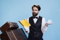 Male bellhop reads new story from book