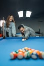 male billiard player poking the cue ball seriously Royalty Free Stock Photo