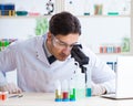 Male biochemist working in the lab on plants Royalty Free Stock Photo