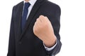 Male in black suit makes an effort gesture with his left hand fisted Royalty Free Stock Photo