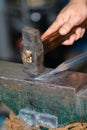 Male blacksmith in his smithy workshop