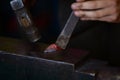 Male blacksmith in his smithy workshop