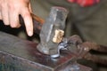 Male blacksmith in his smithy workshop