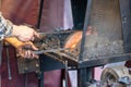 Male blacksmith working in workshop, London. Concept