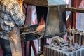 Male blacksmith working in workshop, London. Concept